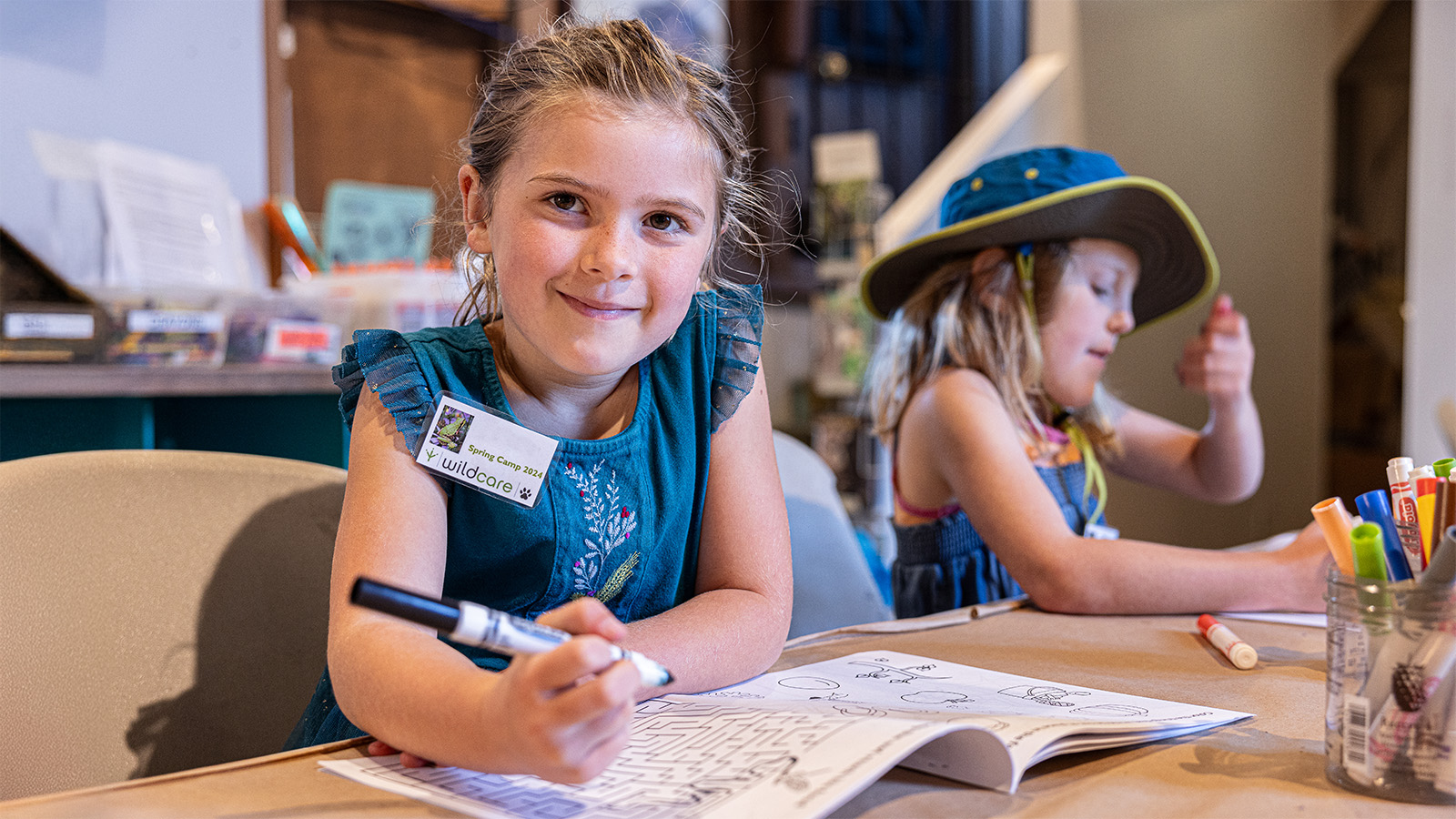 Summer campers engaging in puzzles and indoor activities. Photo: Dion Campbell